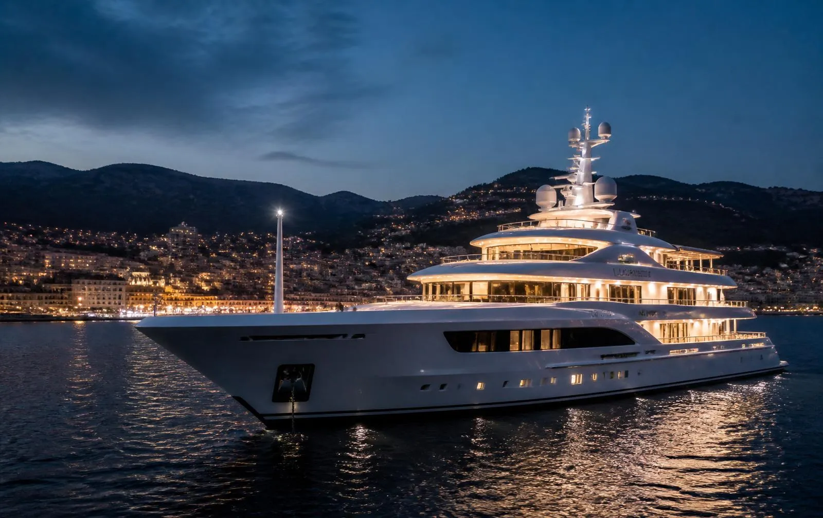 A superyacht at anchor at dusk